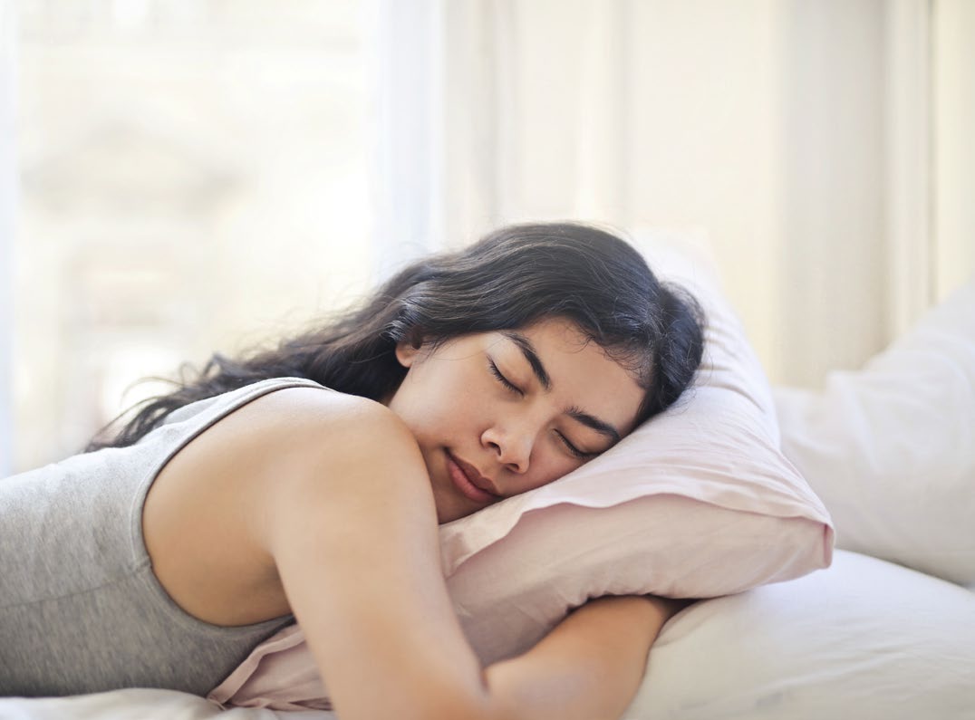 Someone sleeping comfortably with a pillow